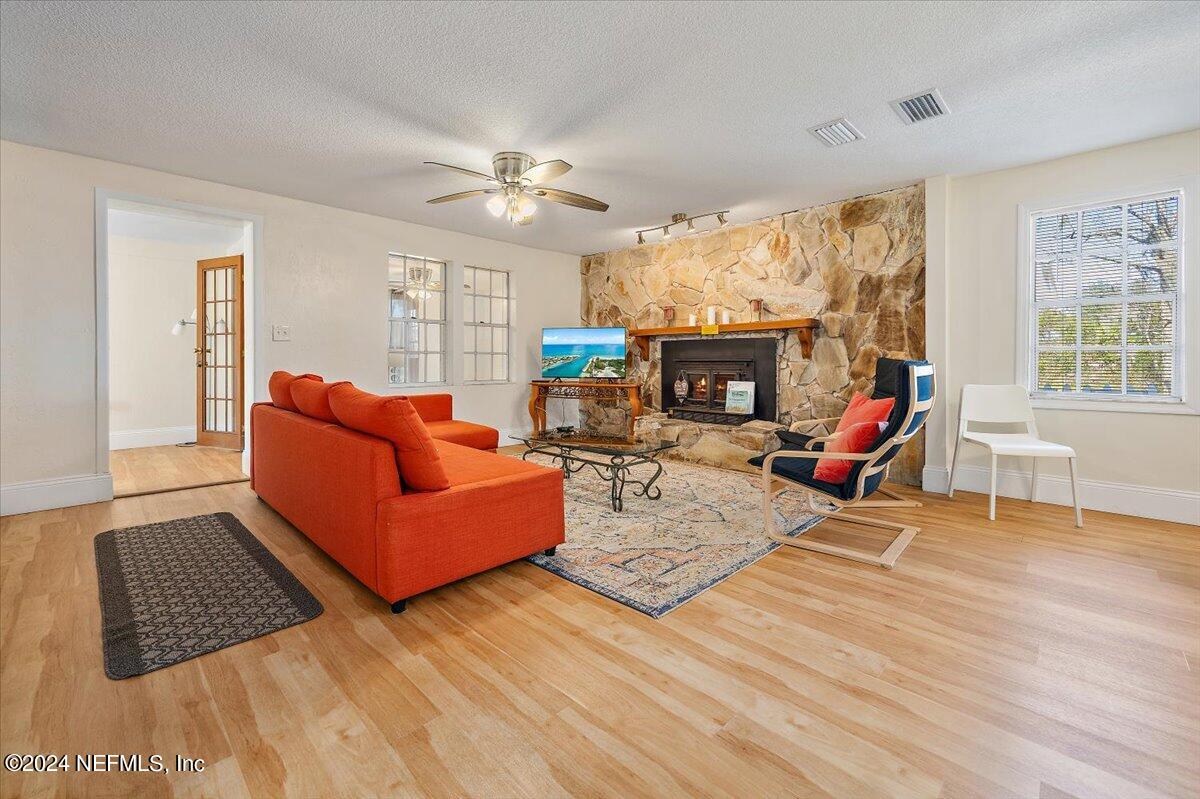 2610 Pacetti Road, Unit A St. Augustine, FL 32092 - Photo 8 of 31 a living room with furniture fireplace and a large window
