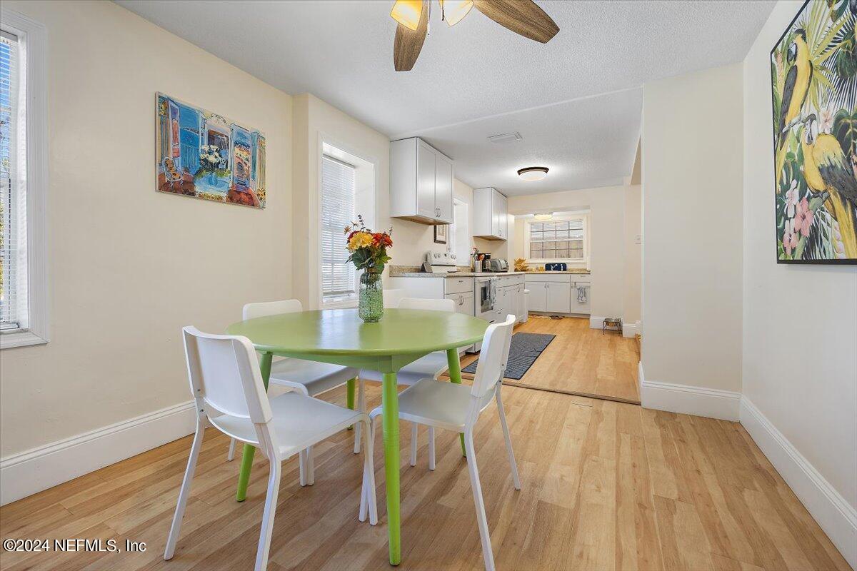 2610 Pacetti Road, Unit A St. Augustine, FL 32092 - Photo 9 of 31 a view of a dining room with furniture and wooden floor