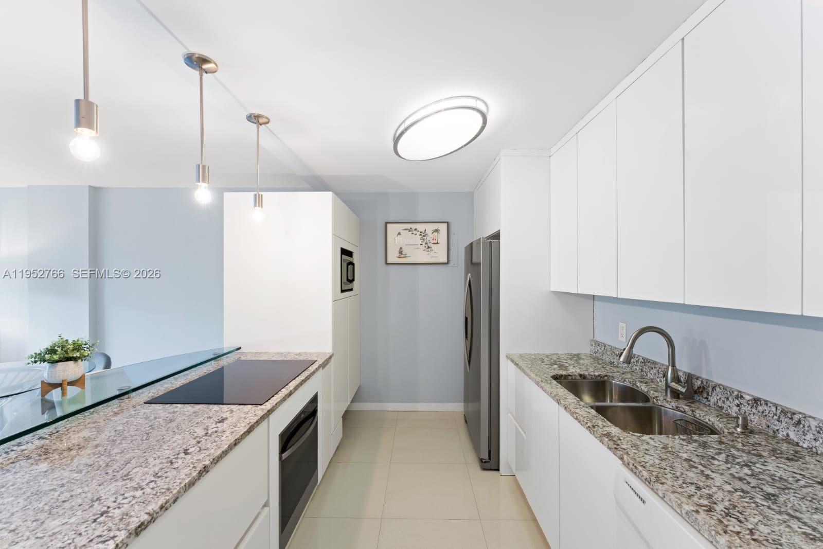 155 Ocean Ln Drive, Unit 407 Key Biscayne, FL 33149 - Photo 5 of 14 REMODELED KITCHEN