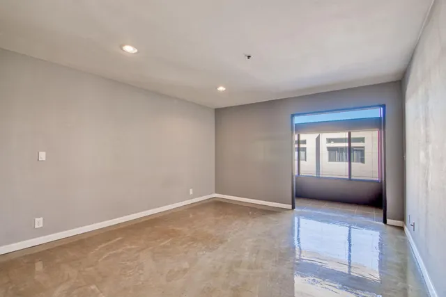 a view of an empty room with a window