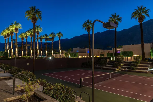 a front view of a building with garden