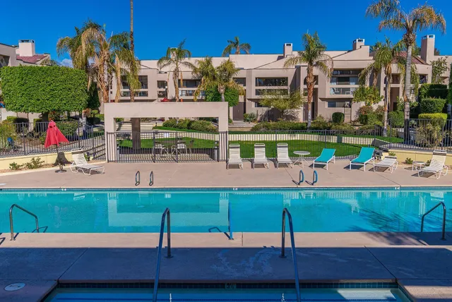 a small pool with outdoor seating