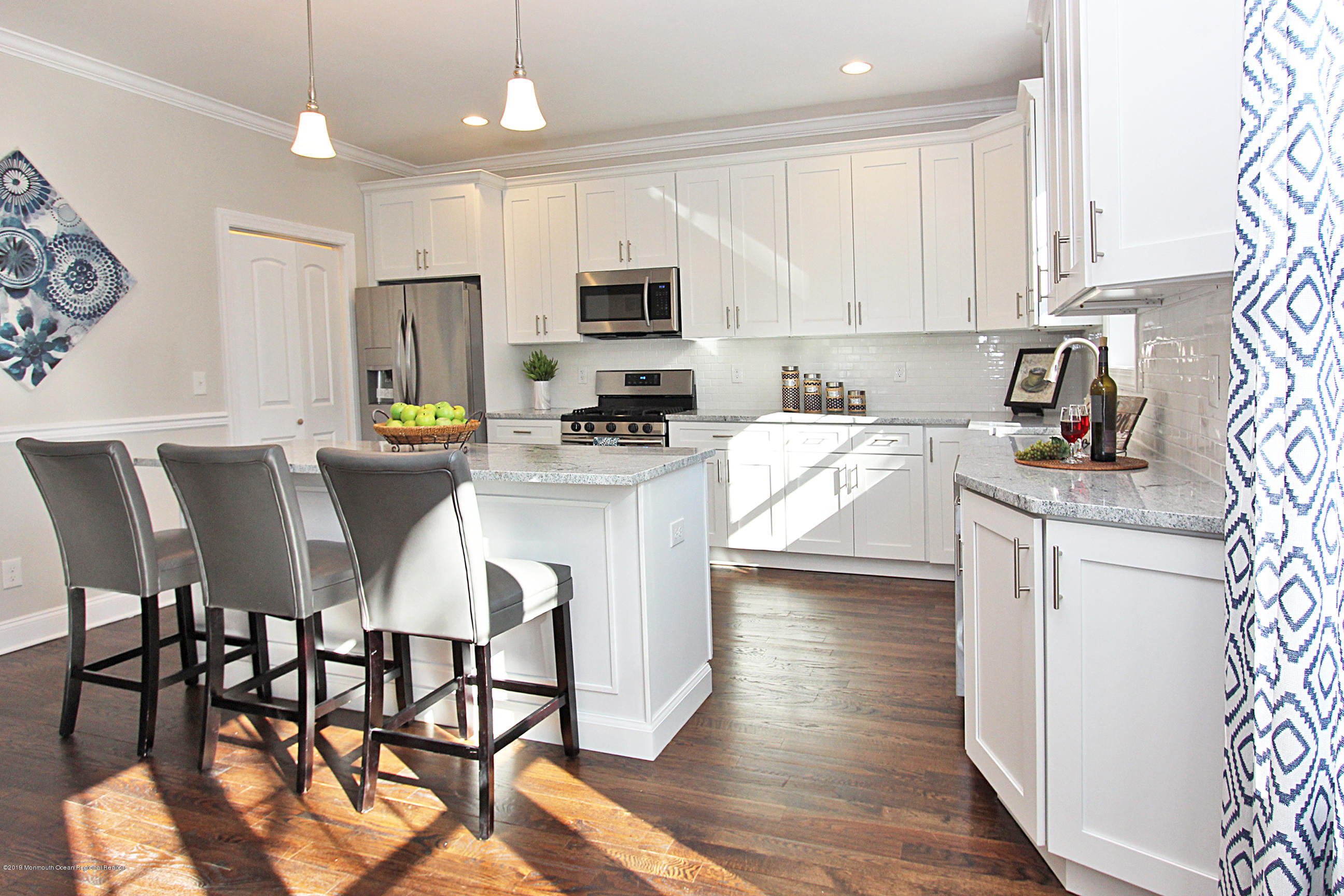 239 Old Mill Road Freehold, NJ 07728 - Photo 10 of 29 Kitchen counter & pantry door
