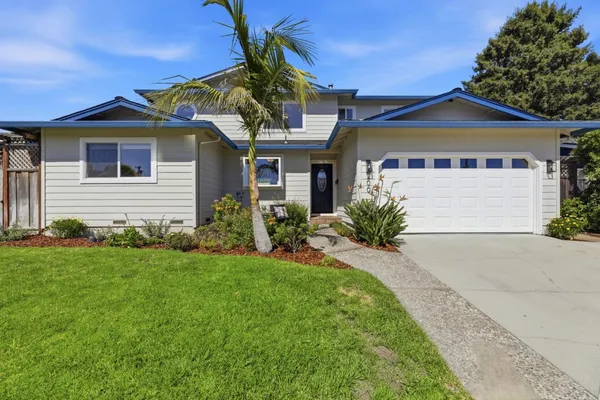 a front view of a house with a yard