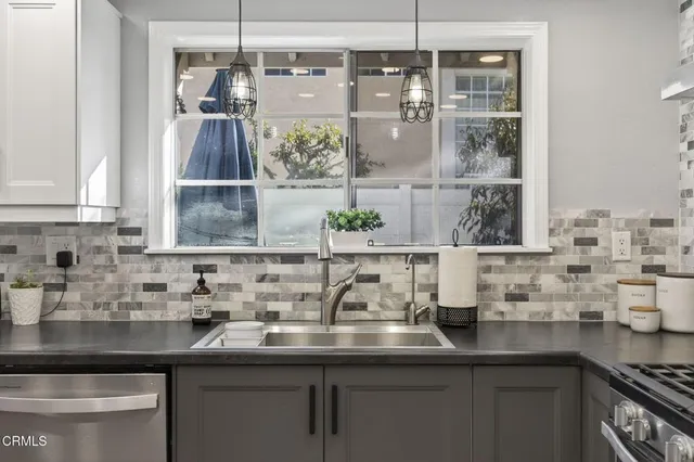 a kitchen with a sink and a window