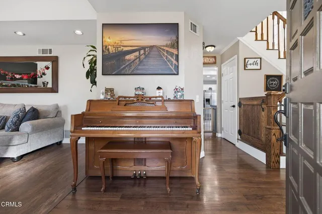 a room with furniture and wooden floor