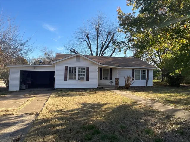 a front view of a house with yard