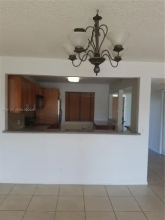 a view of a storage & utility room with a sink