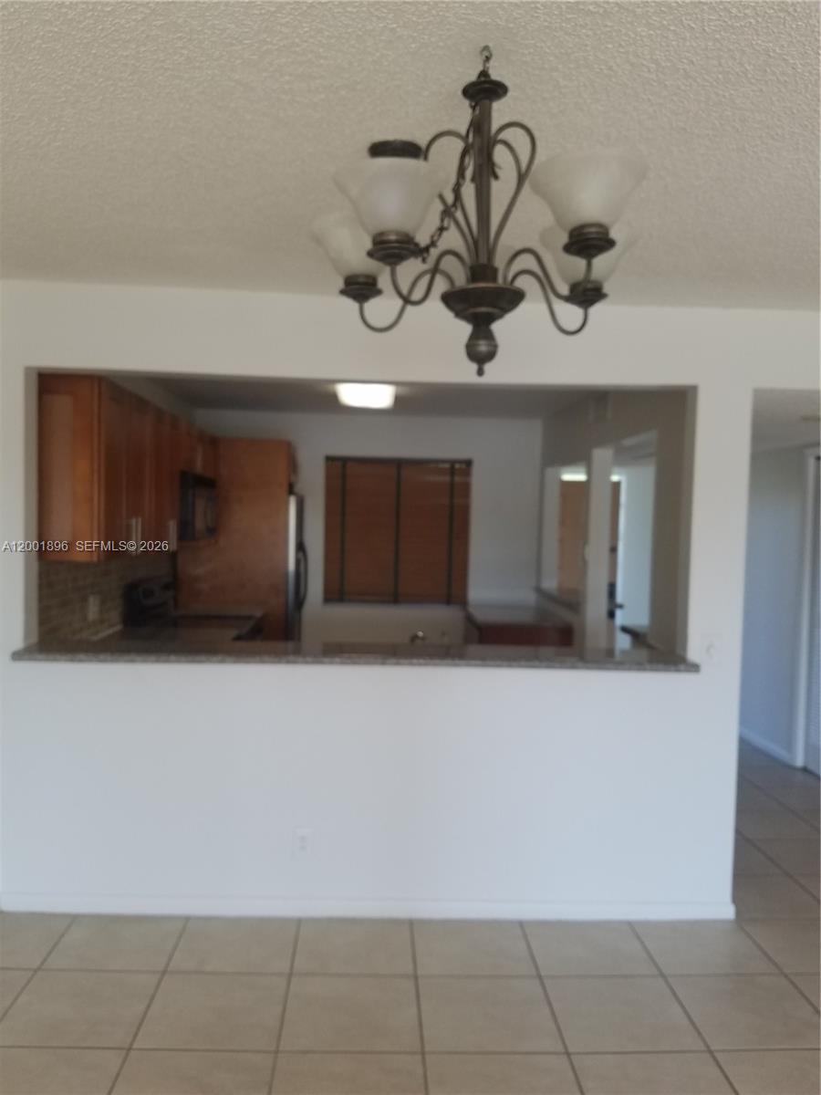 310 Racquet Club Road, Unit 204 Weston, FL 33326 - Photo 19 of 22 a view of a storage & utility room with a sink