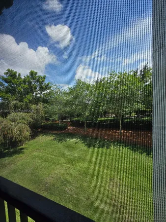 a view of a swimming pool with a garden