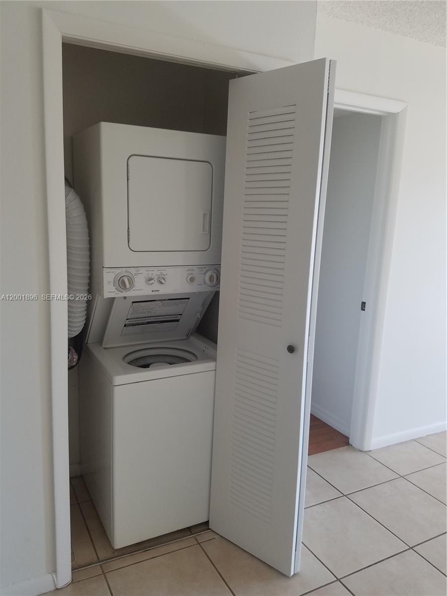 310 Racquet Club Road, Unit 204 Weston, FL 33326 - Photo 10 of 22 a utility room with dryer and washer