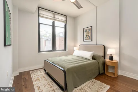 a bed room with a bed and a window