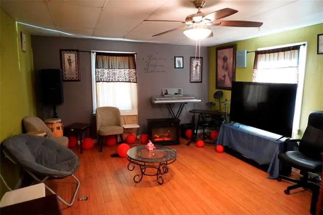 a kitchen with a sink a stove and chairs