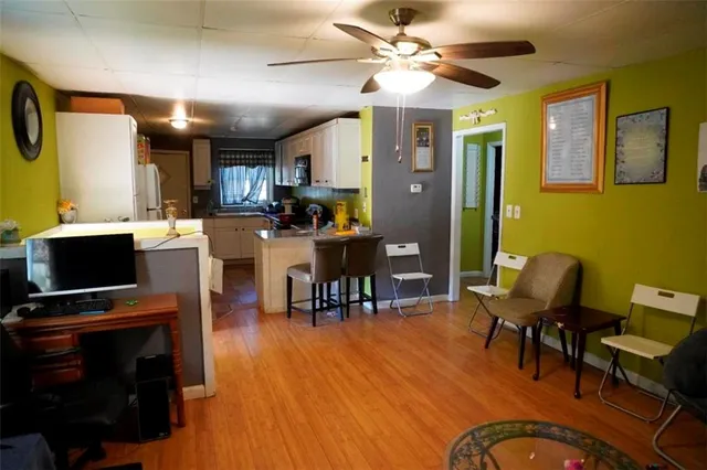 a kitchen with stainless steel appliances granite countertop a stove a sink dishwasher and a refrigerator