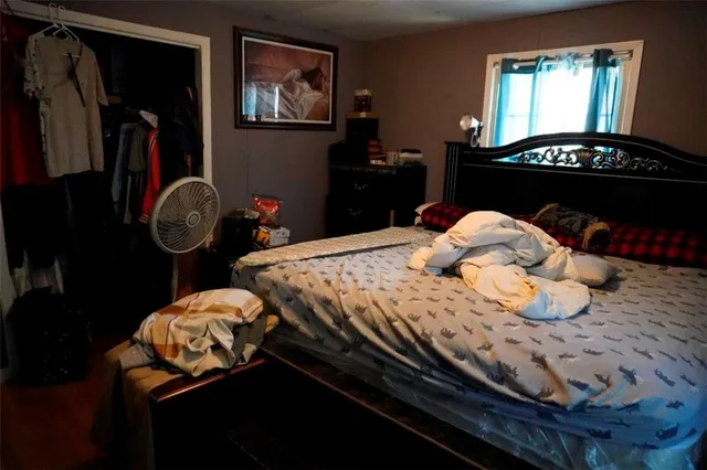 a view of a workspace with furniture and wooden floor