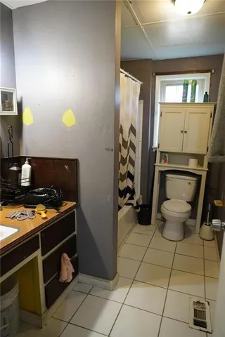 a kitchen with a sink cabinets and utility