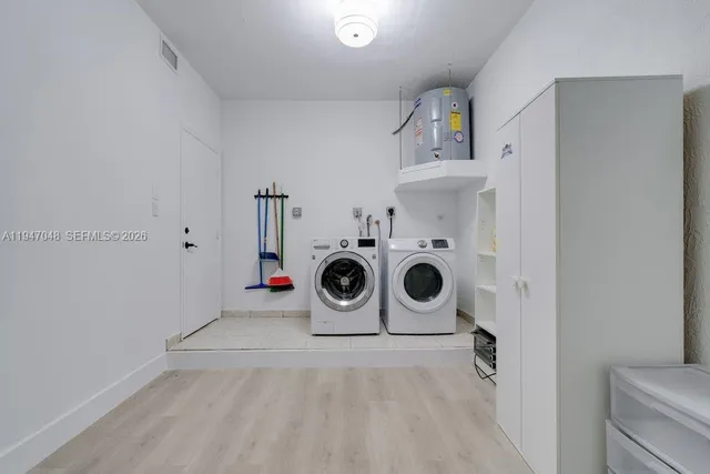 a view of a kitchen with baby cabinets
