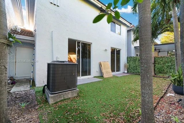a view of a backyard with potted plants
