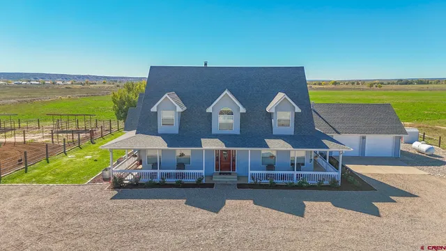 a view of a house with outdoor space and sitting area