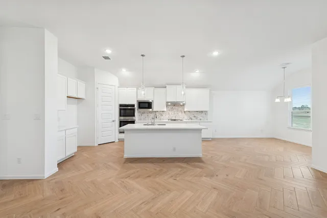 a view of kitchen with wooden floor