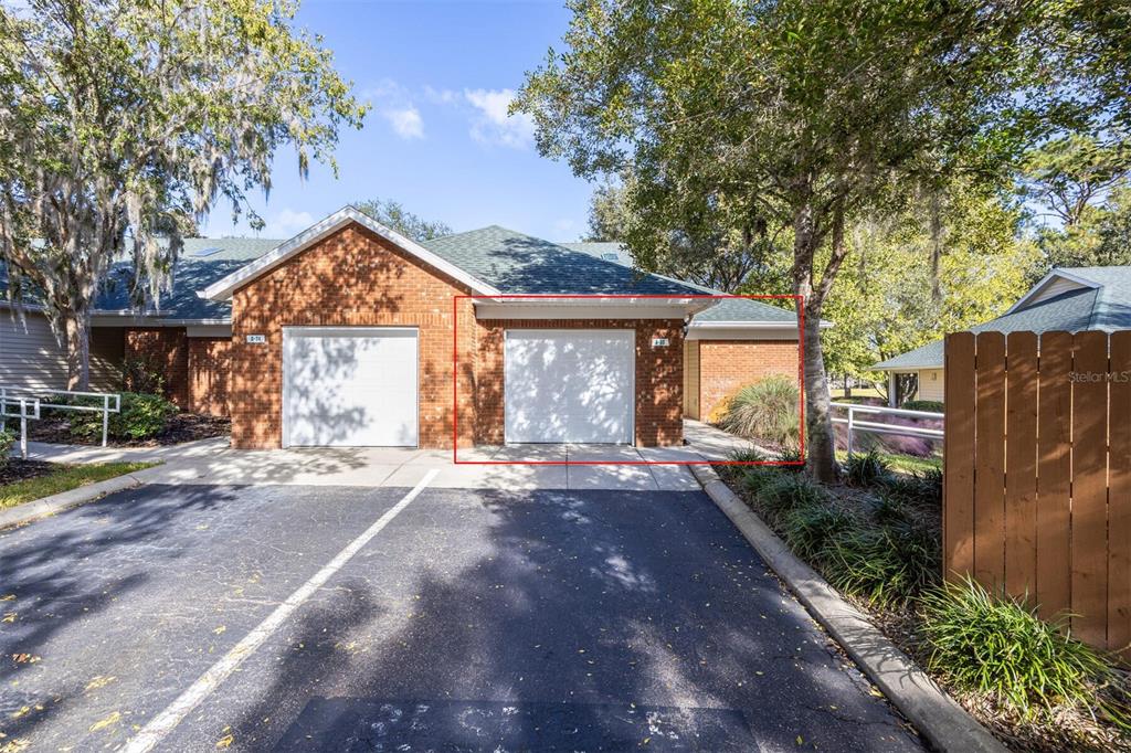 13200 West Newberry Road, Unit G33 Newberry, FL 32669 - Photo 1 of 1 a front view of a house with garden