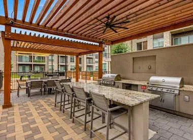 a patio with a table and chairs