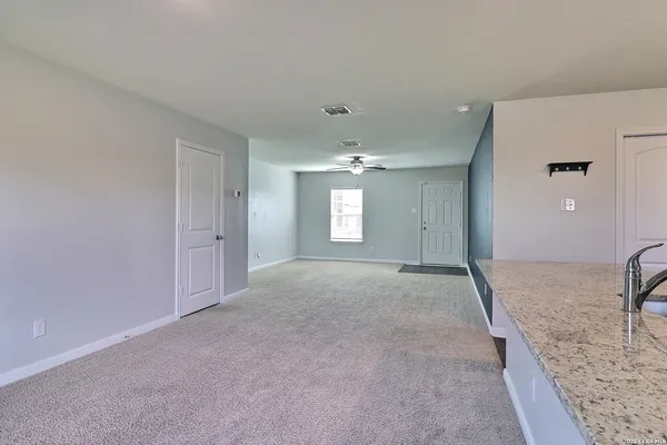a view of livingroom with kitchen