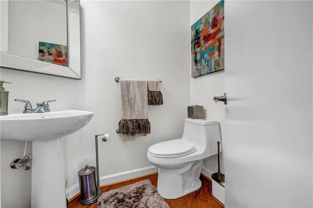 a bedroom with a bed dresser and flat screen tv