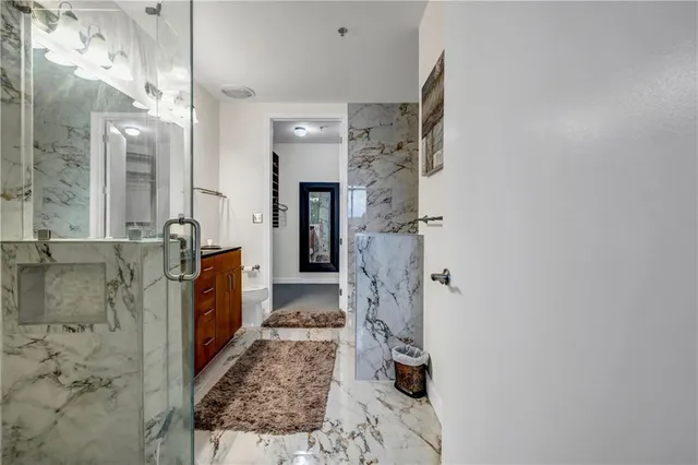 a bathroom with a bathtub and shower