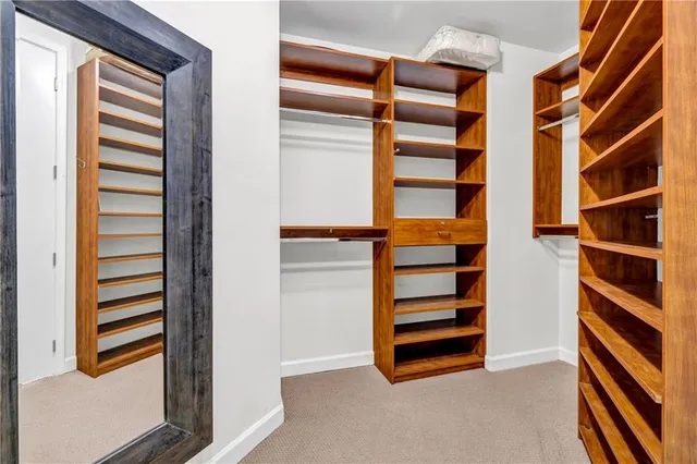 a kitchen with stainless steel appliances a sink stove and cabinets