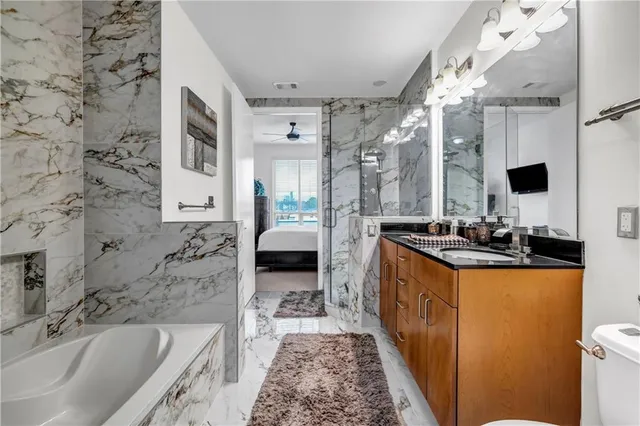 a bedroom with a bed and a chair