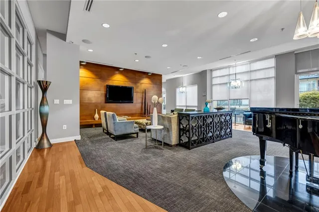 a kitchen with stainless steel appliances kitchen island granite countertop a stove and a sink