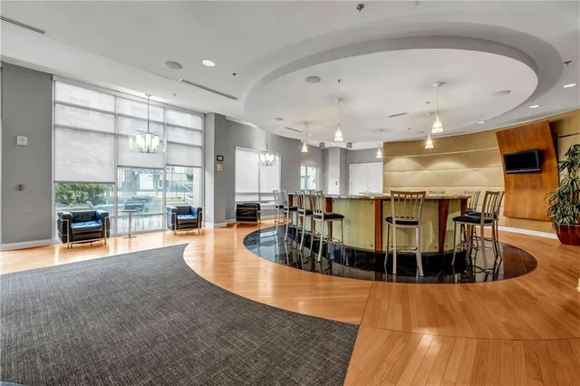 a kitchen with stainless steel appliances kitchen island granite countertop a sink and cabinets