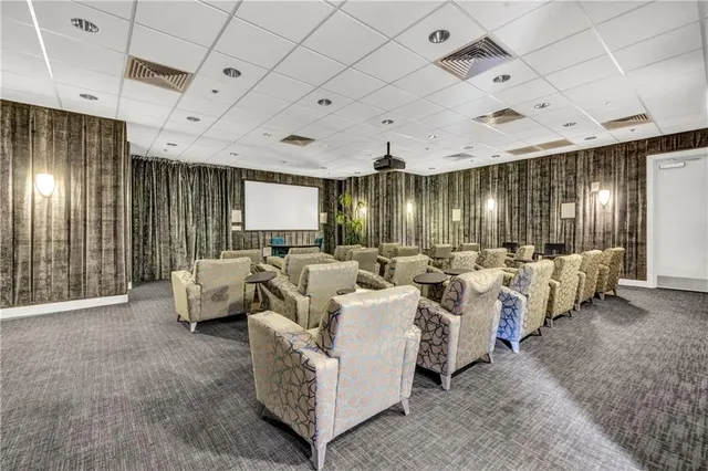 a room with furniture and a clock