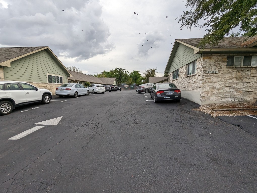 1309 East 52nd Street, Unit 2 Austin, TX 78723 - Photo 12 of 13 a view of car parked in front of a house