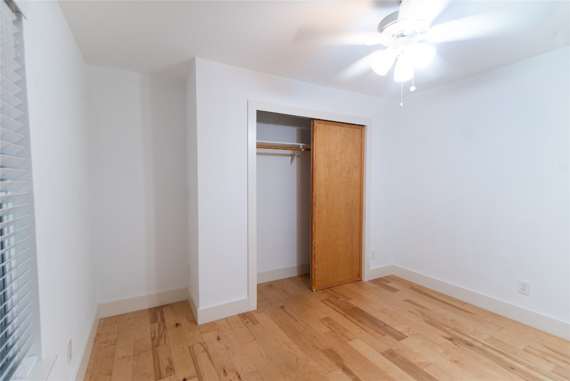 1309 East 52nd Street, Unit 2 Austin, TX 78723 - Photo 5 of 13 an empty room with closet and a ceiling fan