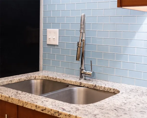 a view of a sink a mirror