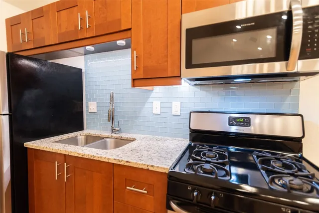 a kitchen with a stove and a microwave