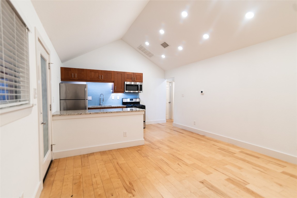 1309 East 52nd Street, Unit 2 Austin, TX 78723 - Photo 9 of 13 a view of kitchen with stainless steel appliances cabinets