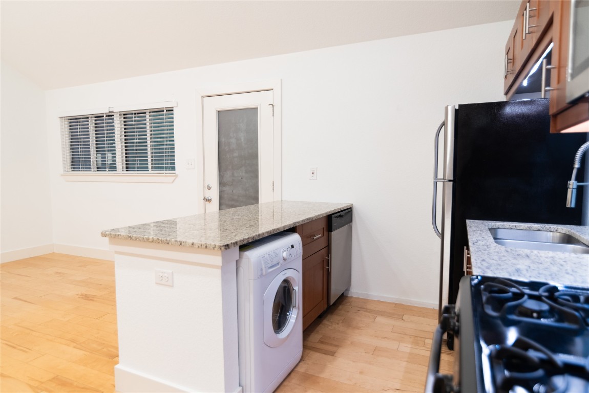 1309 East 52nd Street, Unit 2 Austin, TX 78723 - Photo 10 of 13 a utility room with dryer and washer