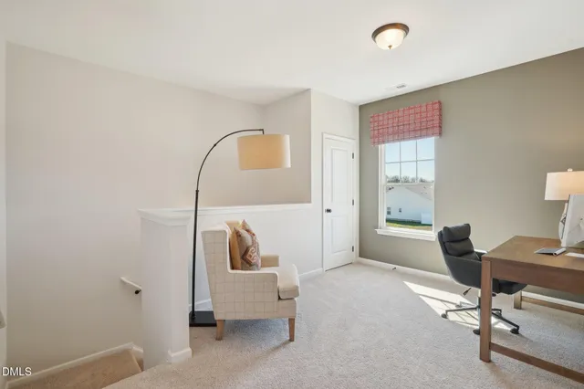 a view of workspace with a window and lounge chair