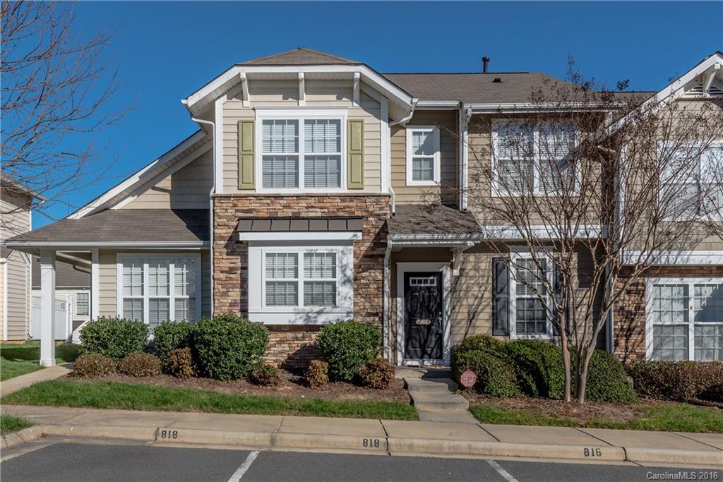 816 Gentlewinds Court, Unit 816 Fort Mill, SC 29708 - Photo 1 of 24 a front view of a house with a yard