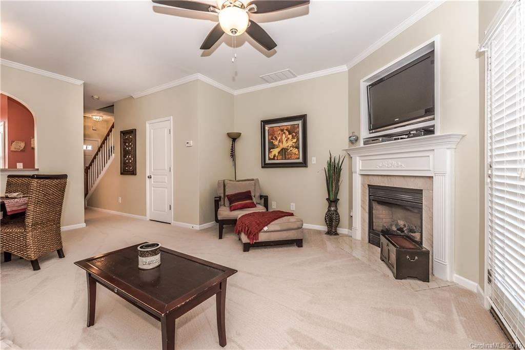 816 Gentlewinds Court, Unit 816 Fort Mill, SC 29708 - Photo 12 of 24 a living room with furniture and a fireplace
