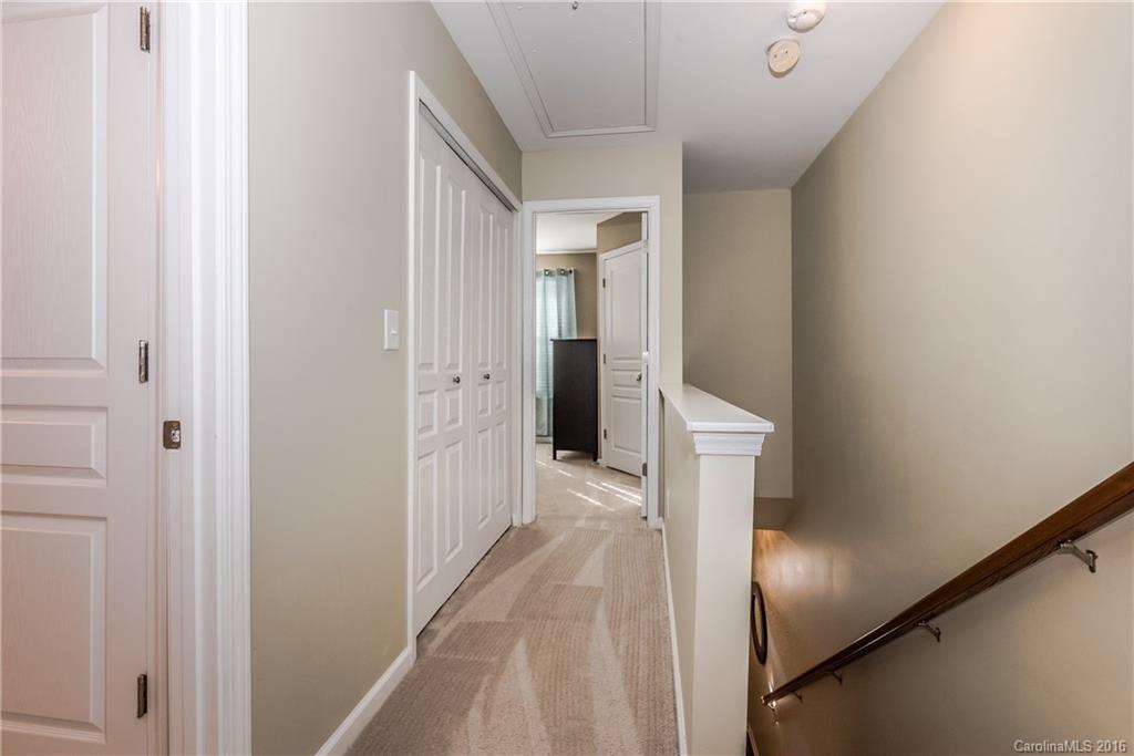 816 Gentlewinds Court, Unit 816 Fort Mill, SC 29708 - Photo 14 of 24 a view of a hallway with white walls