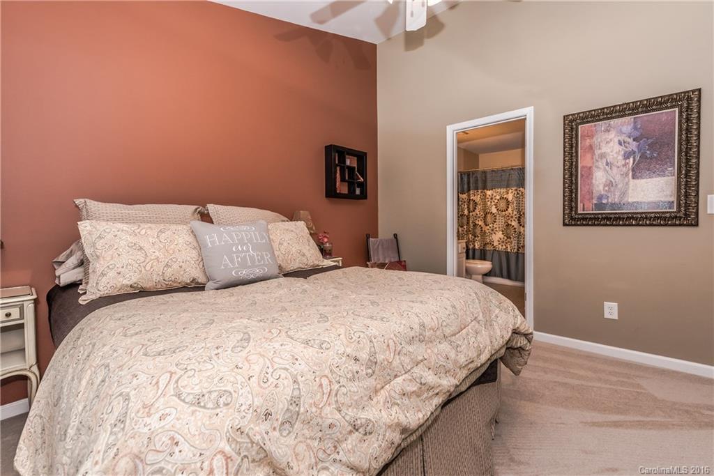 816 Gentlewinds Court, Unit 816 Fort Mill, SC 29708 - Photo 16 of 24 a bedroom with a bed and painting on the wall