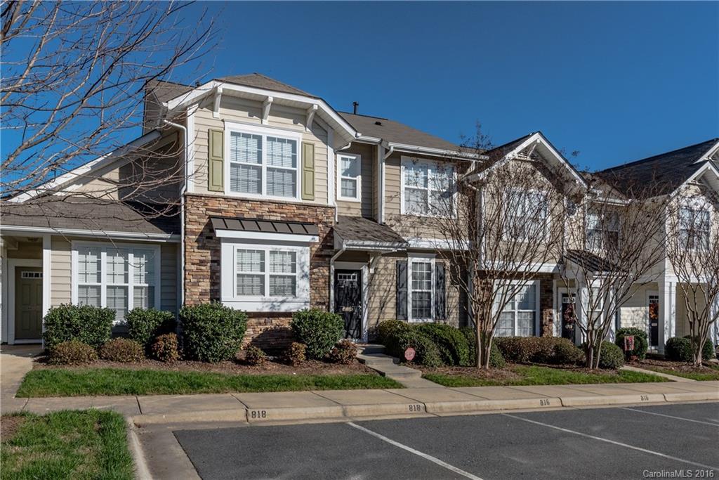 816 Gentlewinds Court, Unit 816 Fort Mill, SC 29708 - Photo 24 of 24 a front view of a residential apartment building with a yard