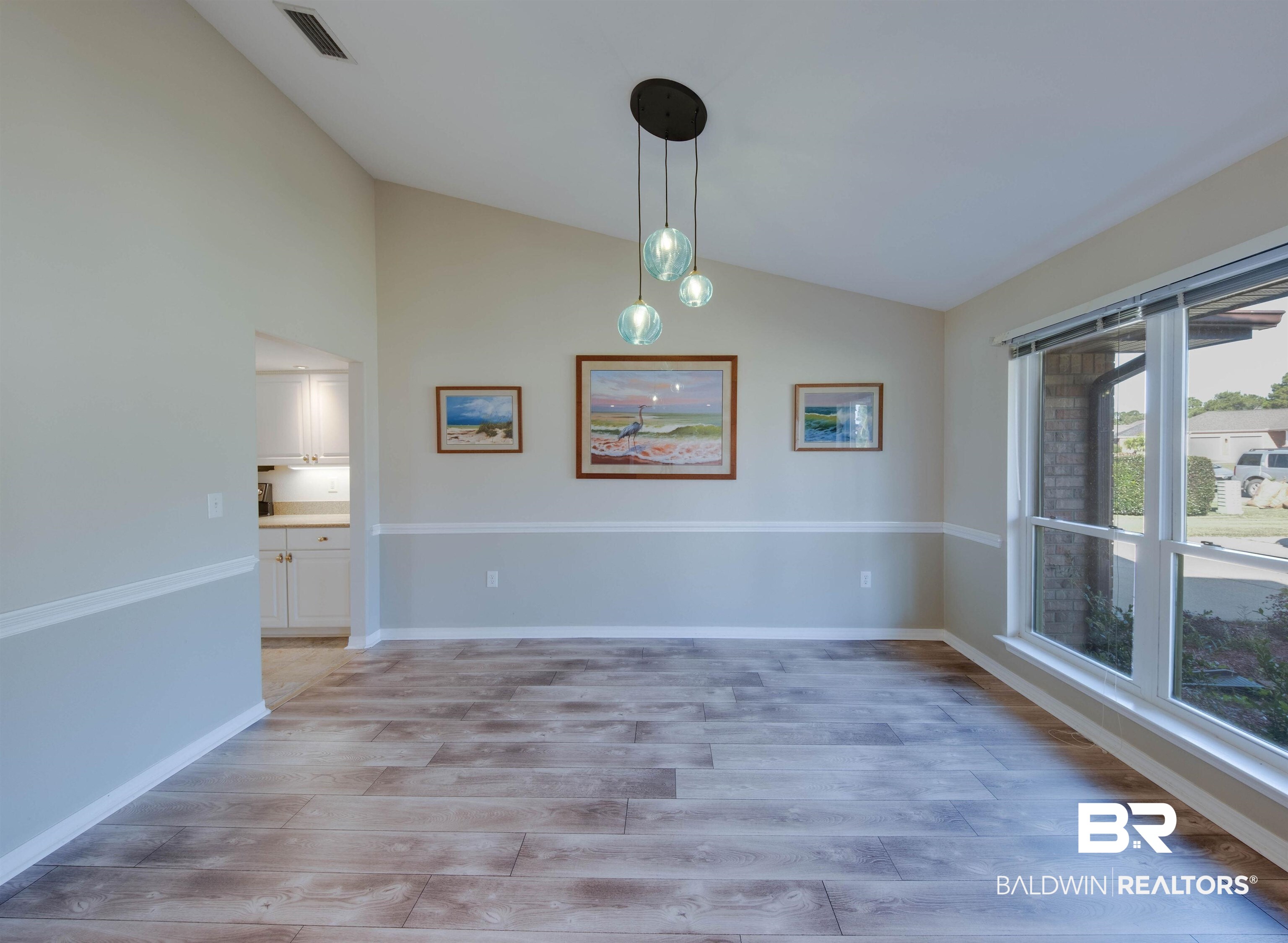 9462 Lakeview Drive Foley, AL 36535 - Photo 7 of 50 Unfurnished dining area featuring light hardwood / wood-style flooring and lofted ceiling