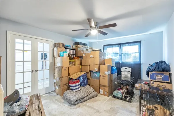 a bedroom with furniture and a window