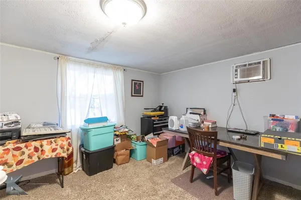 a living room with furniture a window and a wooden floor