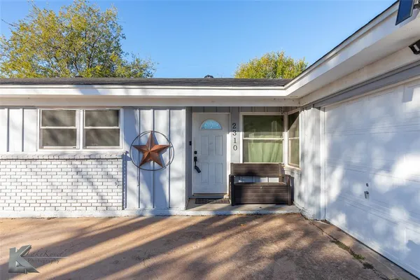 a front view of a house with a porch